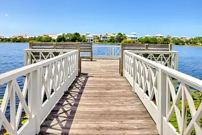 a wooden bridge over a body of water at Lily Pad in Panama City Beach