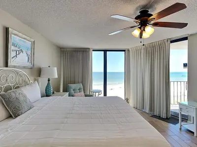 a bedroom with a large bed with a ceiling fan at Edgewater Tower Ii 403 in Panama City Beach