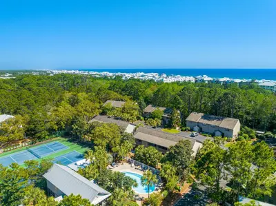 an aerial view of a resort with a tennis court at Cassine Gardens by Panhandle Getaways in Santa Rosa Beach