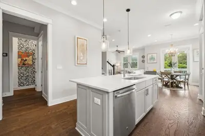 a kitchen with a sink and a counter top at Coastal Cottage at 30A in Inlet Beach