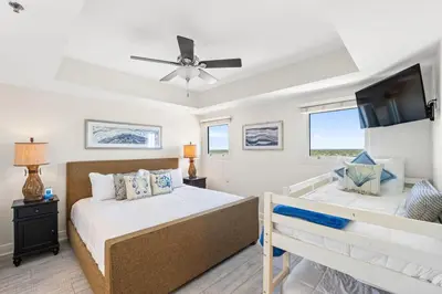a bedroom with two beds and a ceiling fan at Sterling Breeze 1507 in Panama City Beach