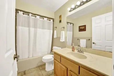 a bathroom with a sink and a toilet and a shower at Regency Towers 404 in Panama City Beach