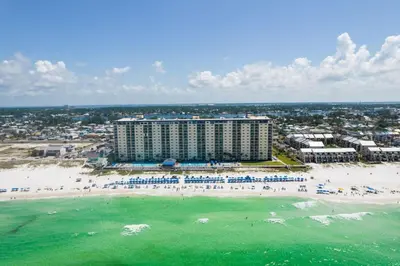 an aerial view of a beach with a hotel at Regency Towers 404 in Panama City Beach