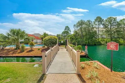 a bridge over a river with a no entry sign at The Beachy Boater at St Thomas Square #305 by Nautical Properties in Panama City Beach