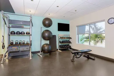a fitness room with a gym with a treadmill at Tru By Hilton Panama City Beach in Panama City Beach