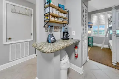 a kitchen with a counter with a blender on it at Aqua Resort 903 in Panama City Beach