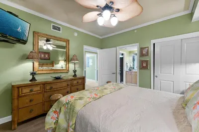 a bedroom with a bed and a ceiling fan at Beachfront Bliss Luxe 3BR Condo at Marisol Complex in Panama City Beach