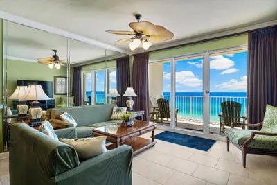 a living room with a view of the ocean at Beachfront Bliss Luxe 3BR Condo at Marisol Complex in Panama City Beach