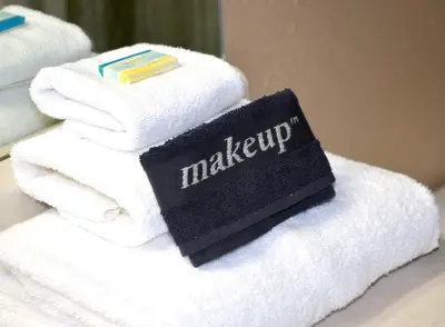 a stack of towels with a sign on them at Sunbird 1204W 'Humphries Hideaway' in Panama City Beach