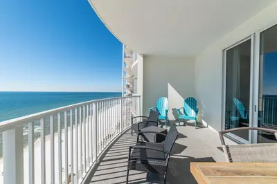 a balcony with chairs and a view of the ocean at Twin Palms 1903 'No Bad Days' in Panama City Beach