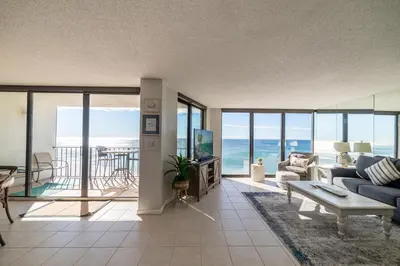 a living room with a view of the ocean at Edgewater 3-1113 'Ocean's 1113' in Panama City Beach
