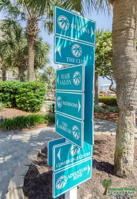 a street sign in front of a palm tree at Edgewater 3-0404 'Isle Be Back' in Panama City Beach