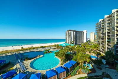 an aerial view of a resort with a pool and the beach at Edgewater 1-0502 'Island Paradise' in Panama City Beach