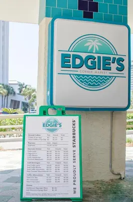 a sign for an eddies restaurant on the side of a building at Edgewater 2-1202 'Shore Fun Penthouse' in Panama City Beach