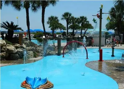 a pool with a water park with a water slide at Edgewater L301 'The Nauti Starfish' in Panama City Beach
