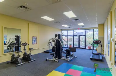 a gym with several treadmills and exercise bikes at Sunbird 0405E 'No Worries' in Panama City Beach