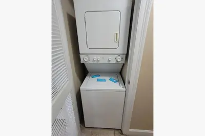 a white washer and dryer in a room at Boardwalk 0605 'Good Times & Tan Lines' in Panama City Beach