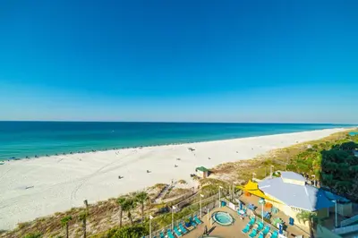 an aerial view of a beach and the ocean at Boardwalk 0605 'Good Times & Tan Lines' in Panama City Beach