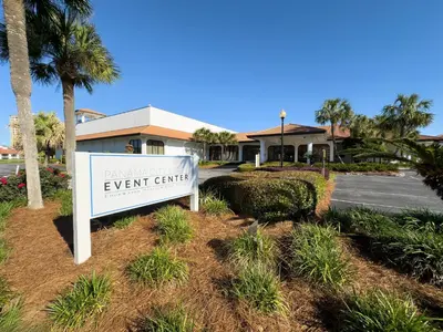 a sign for a event center in front of a parking lot at Edgewater Villa 2708 'Lost Shaker of Salt' in Panama City Beach