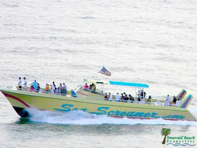 a group of people on a boat in the water at Laketown Wharf 2117 'High Tide' in Panama City Beach