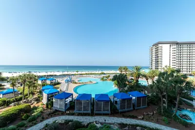 an aerial view of a resort with a swimming pool and the beach at Edgewater 1-0303 'Salty Sunsets' in Panama City Beach