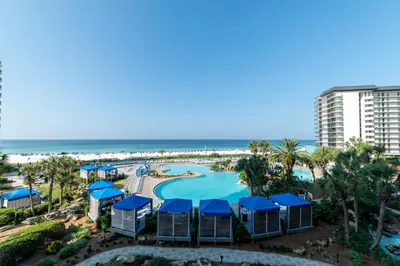 an aerial view of a resort with a pool and the beach at Edgewater 1-0303 'Salty Sunsets' in Panama City Beach