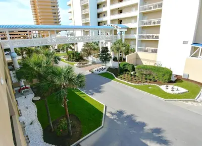 an overhead view of a building with palm trees and a walkway at Seychelles 1602 'Ocean Pearl' in Panama City Beach