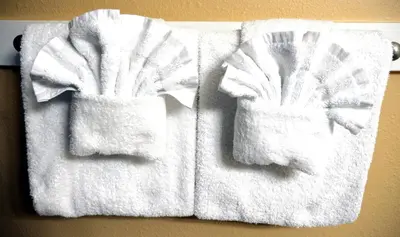 two towels are hanging on a wall at Seychelles 1602 'Ocean Pearl' in Panama City Beach