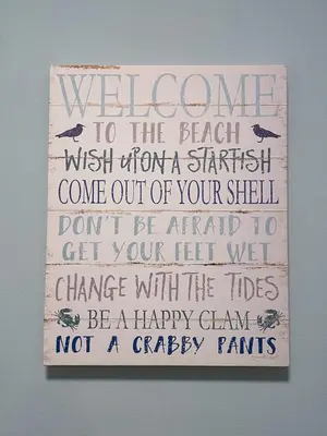 a sign with a welcome to the beach wish upon a come out of your at Laketown Wharf 816 'Tasty Waves PCB' in Panama City Beach
