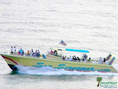 a group of people on a boat in the water at Sunbird 0503W 'Big O's Condo' in Panama City Beach