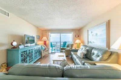 a living room with a couch and a table at Regency Towers 0407 'The Memory Maker' in Panama City Beach