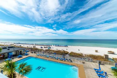 an overhead view of a pool and the beach at Regency Towers 0407 'The Memory Maker' in Panama City Beach