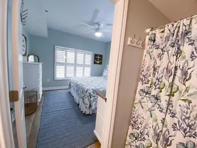 a bedroom with a bed and a window at Shores of Panama 1925 'Sunset Shores' in Panama City Beach