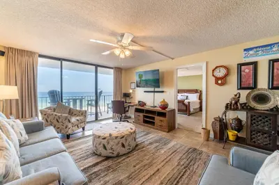 a living room with a view of the ocean at Edgewater 2-0409 'Paradise City' in Panama City Beach