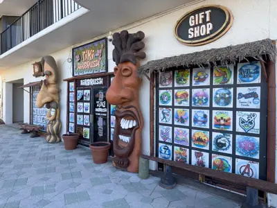 a gift shop with a large face on the side of a building at Edgewater 2-0409 'Paradise City' in Panama City Beach