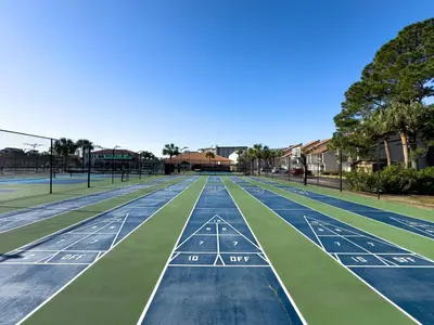 a tennis court with green and blue at Edgewater 2-0203 'Beach Days' in Panama City Beach