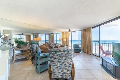 a living room with a view of the ocean at Edgewater W208 Beach Bungalow Bliss in Panama City Beach
