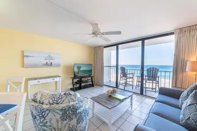 a living room with a view of the ocean at Edgewater 3-0409 'Sunset Place' in Panama City Beach