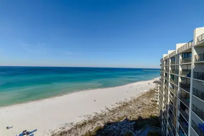 a view of the beach from the balcony of a building at Edgewater 2-1106 'Hidden Pearl' in Panama City Beach
