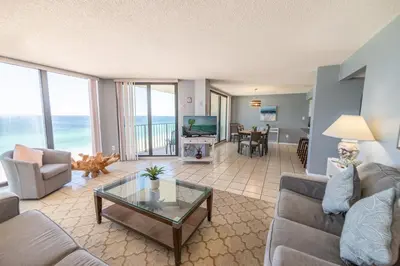 a living room with a view of the ocean at Edgewater 2-1107 'Making Memories' in Panama City Beach