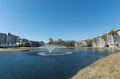 a fountain in the middle of a pond at Edgewater 2-1107 'Making Memories' in Panama City Beach