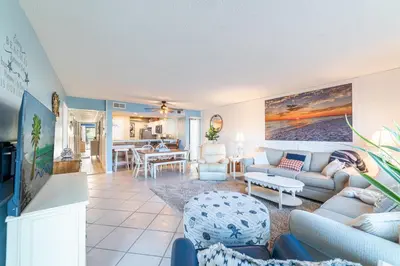 a living room with a couch and a table at Edgewater Villa 1101 'Sunset Paradise At Edgewater' in Panama City Beach