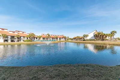 a pond with a fountain in the middle of it at Edgewater Villa 1101 'Sunset Paradise At Edgewater' in Panama City Beach