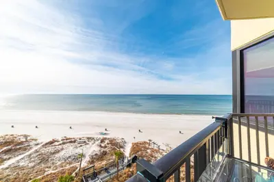 a balcony with a view of the beach at Sunbird 0703E 'Beachhead Paradise' in Panama City Beach