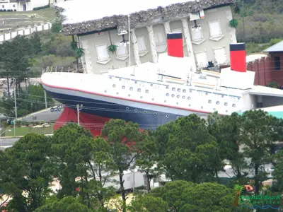 a large cruise ship parked next to a building at Sunbird 0703E 'Beachhead Paradise' in Panama City Beach