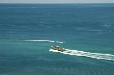 a boat in the water in the ocean at Edgewater 3-1010 'The Salty Coconut' in Panama City Beach