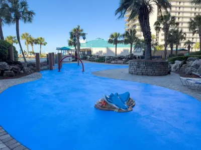 a playground with a slide on a blue carpet at Edgewater Villa 2809 'Shore 'Nuff' in Panama City Beach