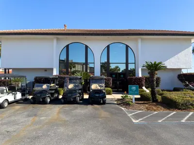 a group of scooters parked in front of a building at Edgewater Villa 0402 'Serenity Now' in Panama City Beach