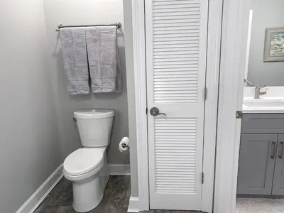 a bathroom with a toilet and a sink at Boardwalk 2201 'Sea Serenity Penthouse' in Panama City Beach
