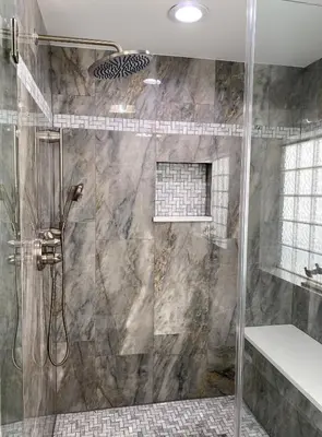 a shower with a glass door in a bathroom at Boardwalk 2201 'Sea Serenity Penthouse' in Panama City Beach